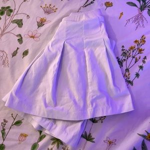 White mini pleated skirt.